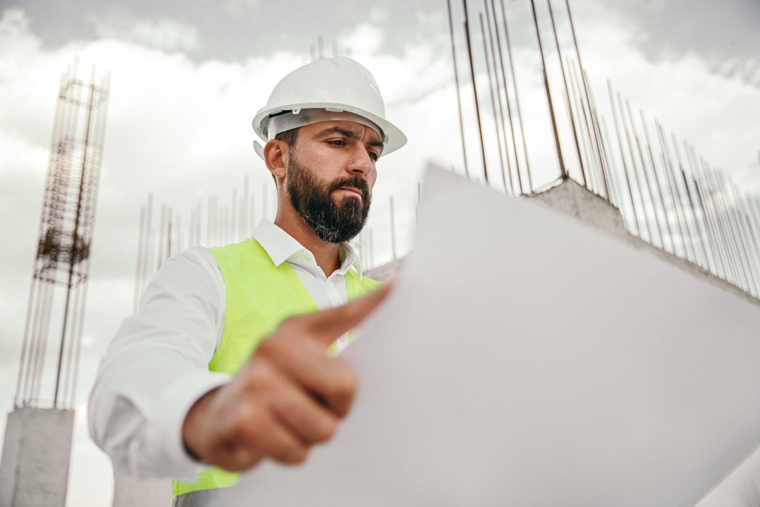 Engineer overseeing concrete work on site